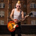 Punk playing guitar.